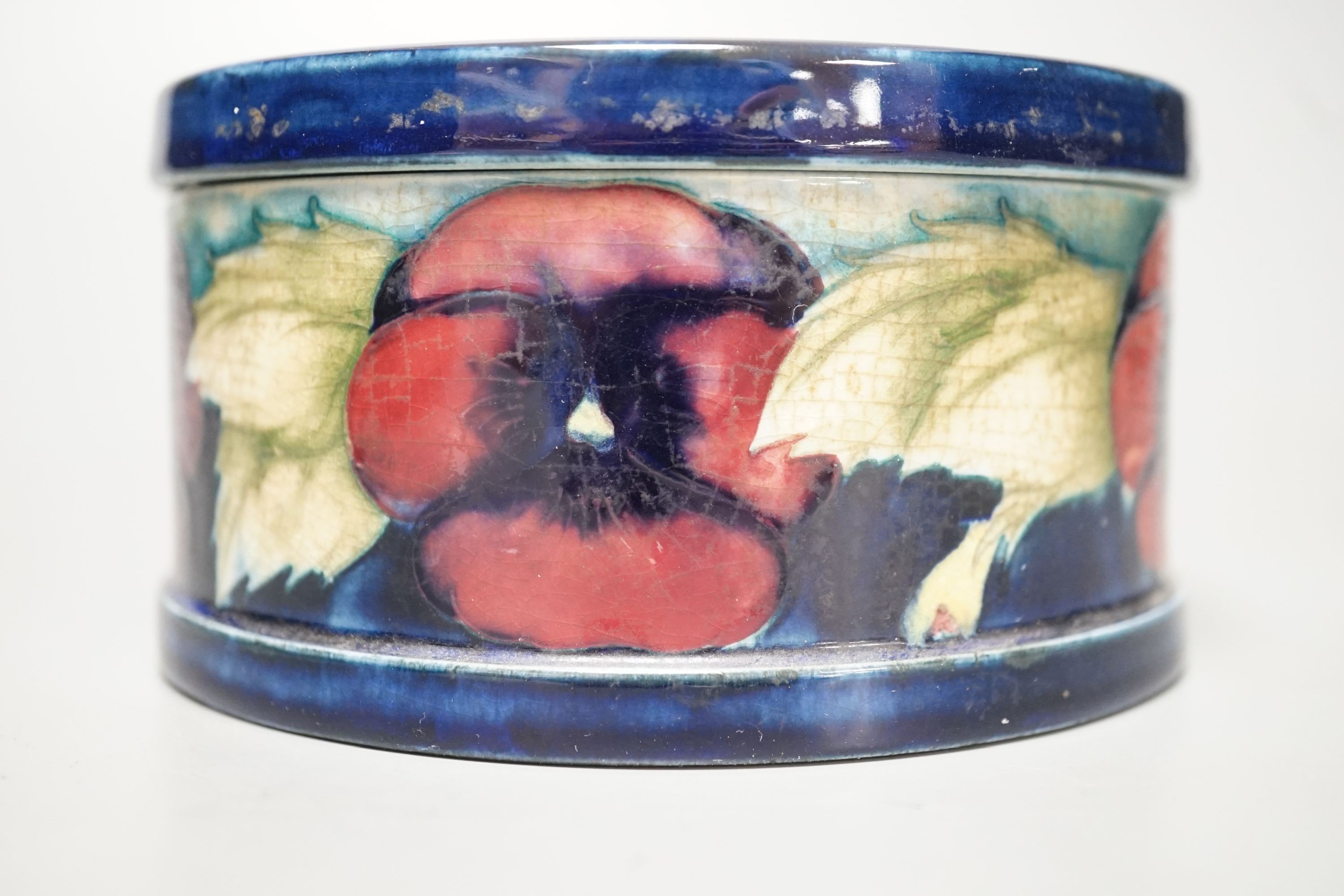 A Moorcroft pansy pattern circular box and cover, diameter 12cm